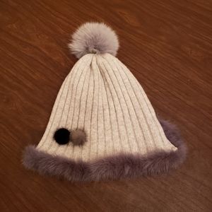 Gray trendy knitted hat with fur Pompom
